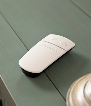 a white remote on a table