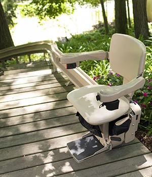 Elite curved outdoor stair lift on wooden staircase