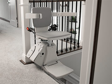 Bruno Elan straight indoor stairlift parked at the top of a staircase