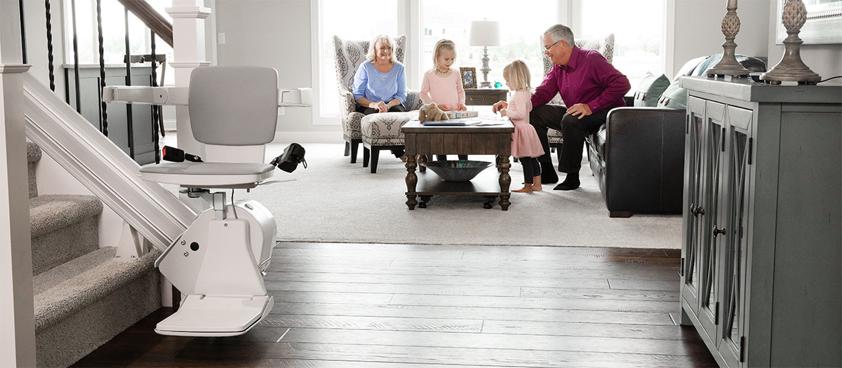 Bruno stairlift parked in from of a family living room
